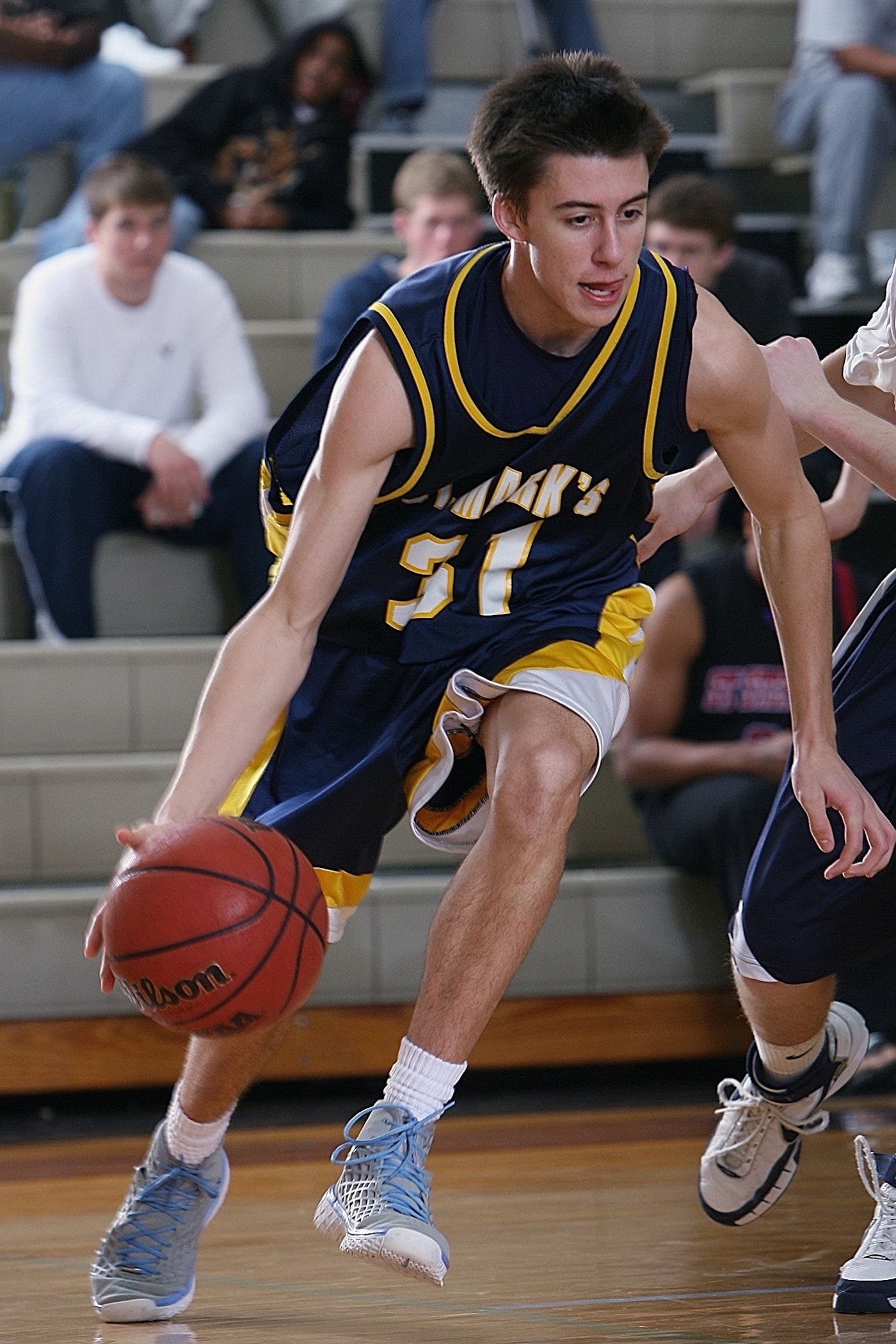 male player dribbling the ball