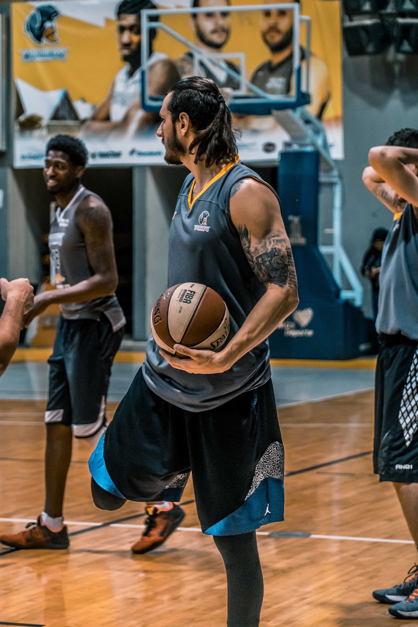 two male players stretching before a game